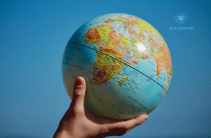 hand holding a globe to signify confidence