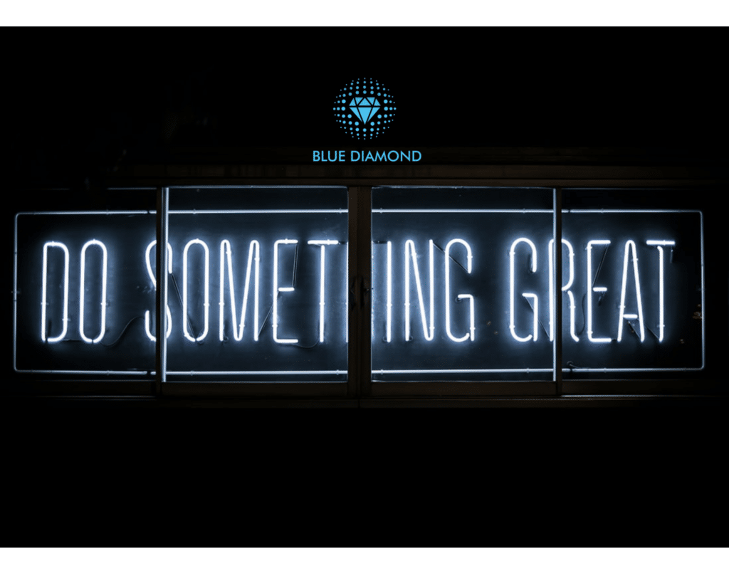Do something great written in neon lights with blue diamond logo
