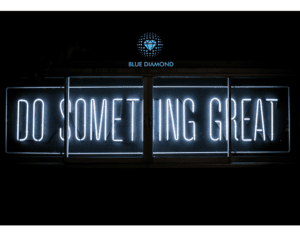 Do something great written in neon lights with blue diamond logo