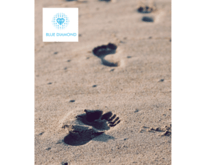 footprints in sand with blue diamond logo