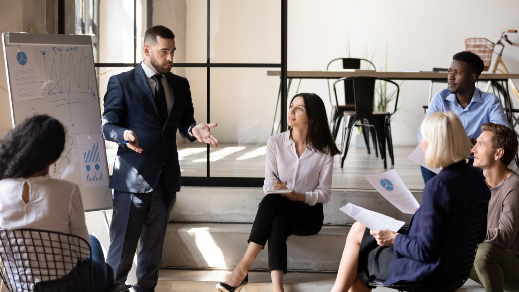 How to Progress in Your Finance Career: From Technical Expert to Leader Finance professional increasing workplace visibility by presenting analytics to executives.