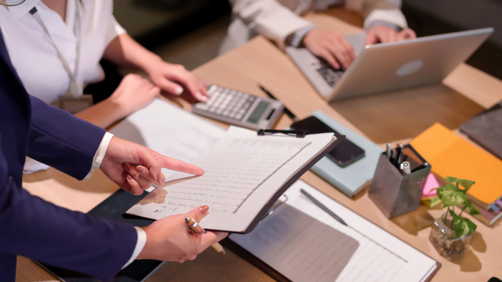 A shot of a person analysing documents showing a new role as finance leader