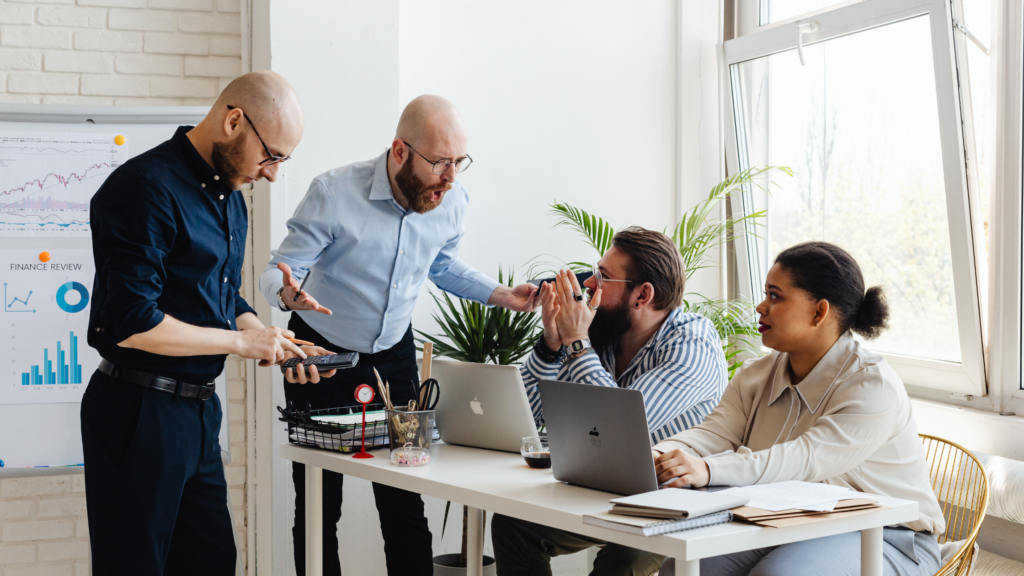 A professional who is coaching, mentoring, and pointing the way forward for a small group of other professionals